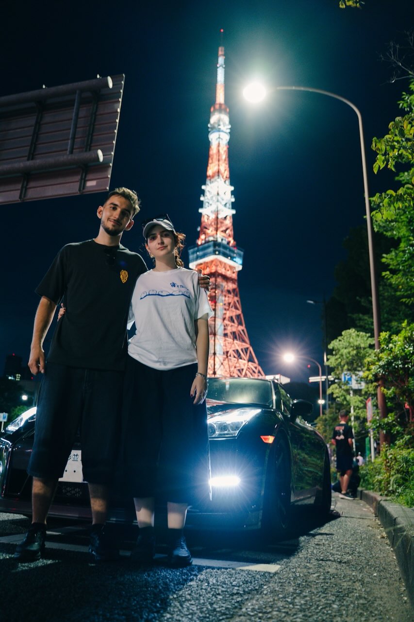 GTR MAFIA TOKYO guests photographed with their Nissan GT-R in front of Tokyo Tower