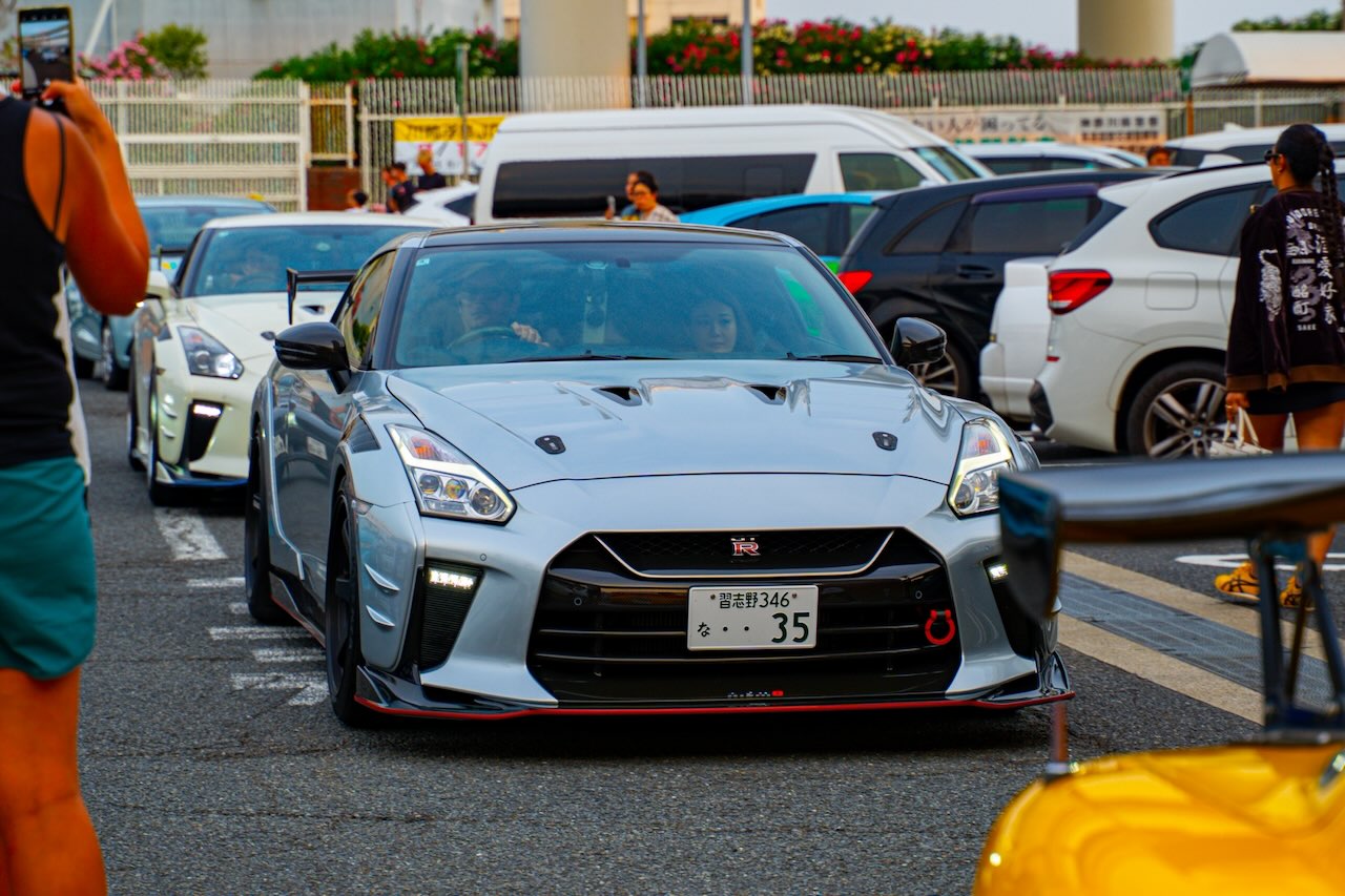 Grey Nissan GT-R R35 Nismo at Daikoku PA in the evening