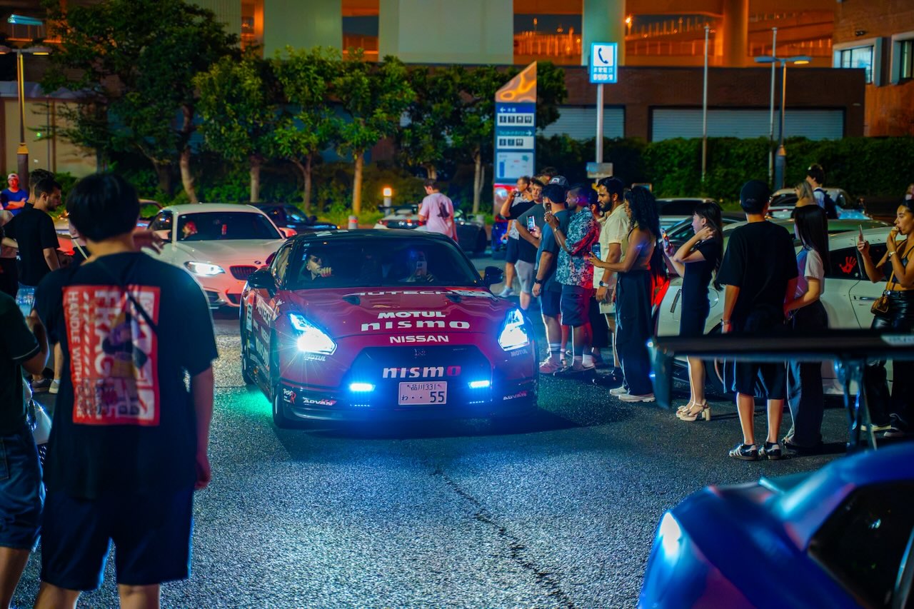 Dark red Motul-liveried Nissan GT-R R35 Nismo at Daikoku PA at night